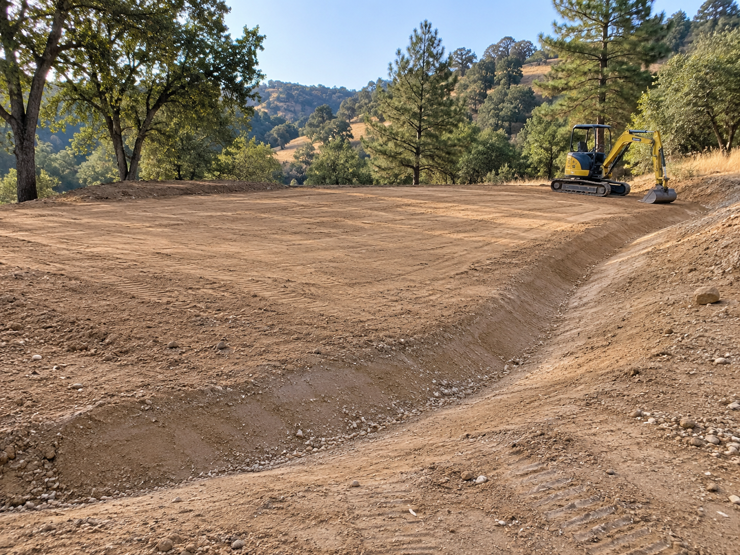 Example of a graded residential site with a drainage swale and excavator